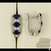 Серебряный комплект Классические  Серёжки с синими фианитами в сочетании с изделием Серебряное кольцо с фиолетовыми фианитами Фото